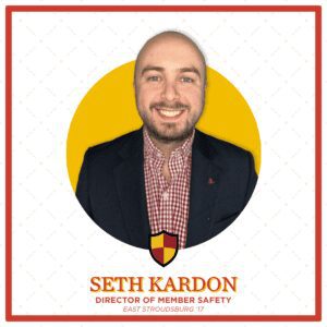 A professional headshot of Seth Kardon in a suit.