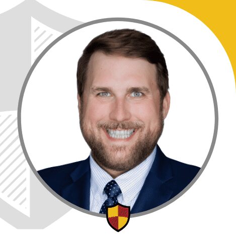 Smiling man in a suit and tie.